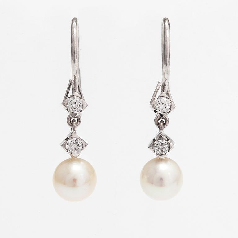 A pair of 18K white gold earrings with cutured pearls and diamonds ca. 0.24 ct in total. Westerback, Helsinki.