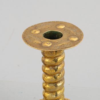 A pair of brass baroque style candlesticks, end of the 19th century.