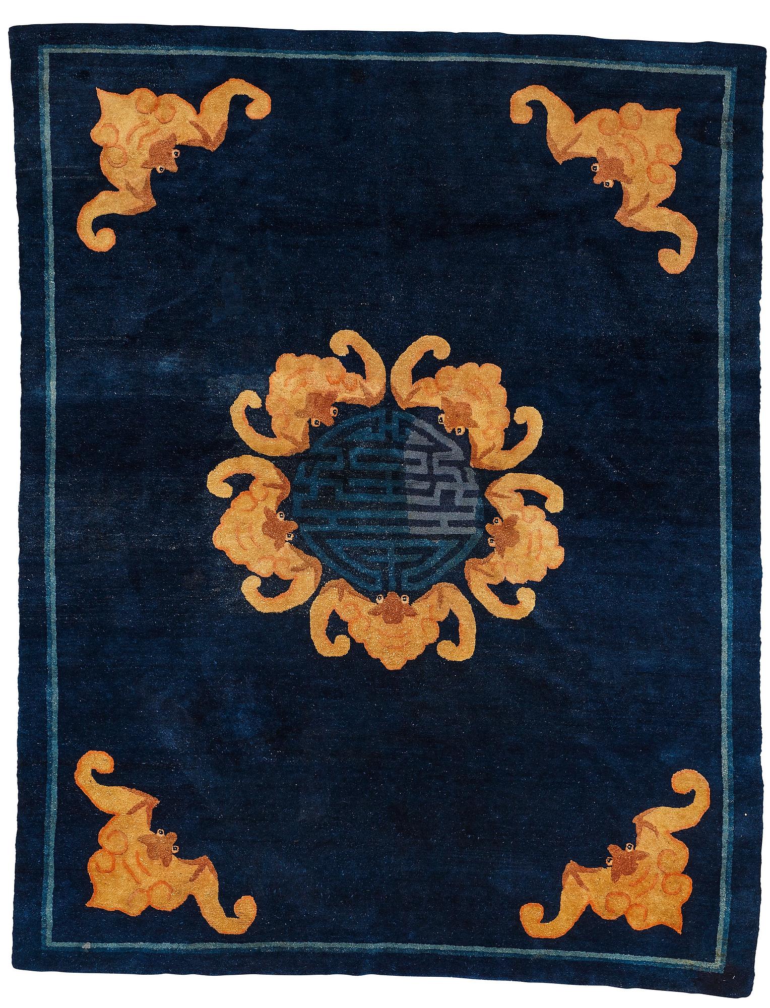 A carpet, a semi-antique Chinese,  ca 255 x 199-202,5 cm.