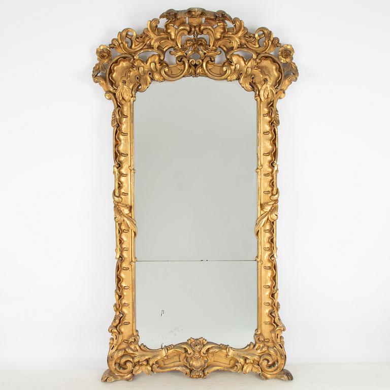 A large rococo-revival gilt-gesso mirror, later part 19th century.