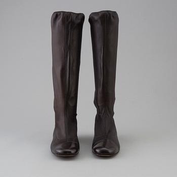 Brown leather boots by Chanel.