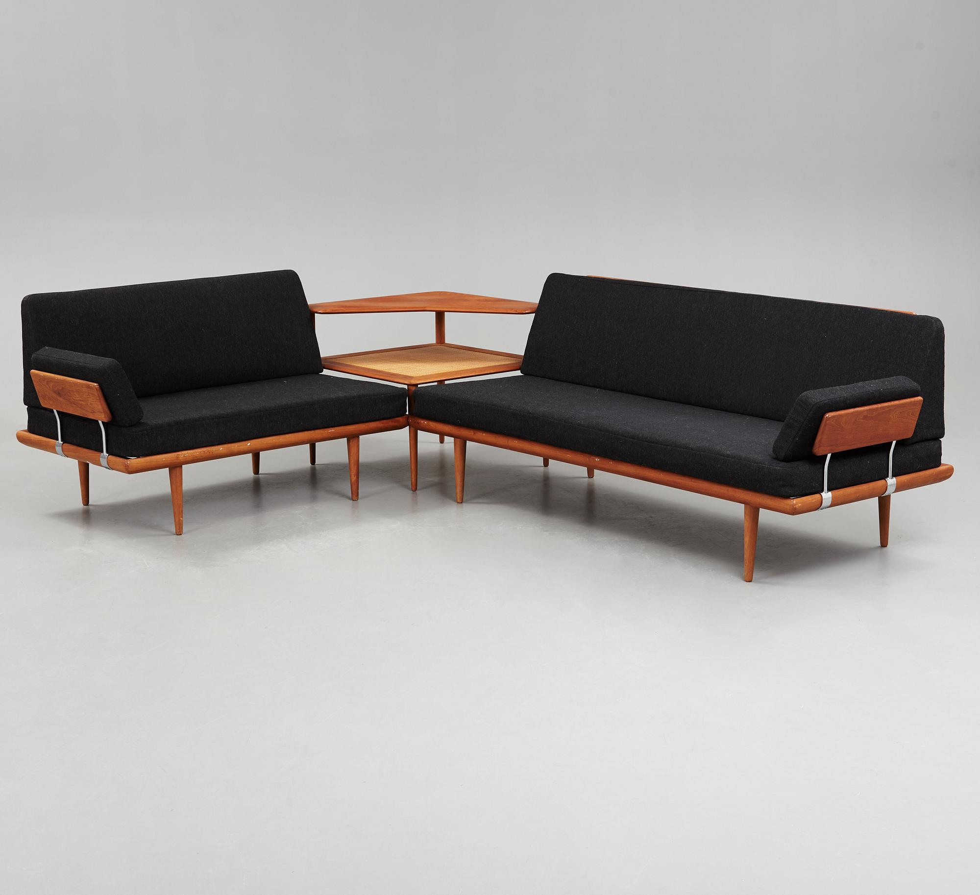 A set of two Danish 'Minerva' sofas with a table for France & Daverkosen.