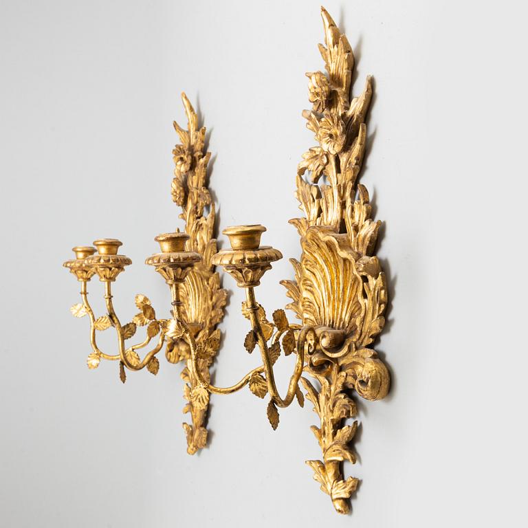 A pair of 20th century Rococo style wall lights.