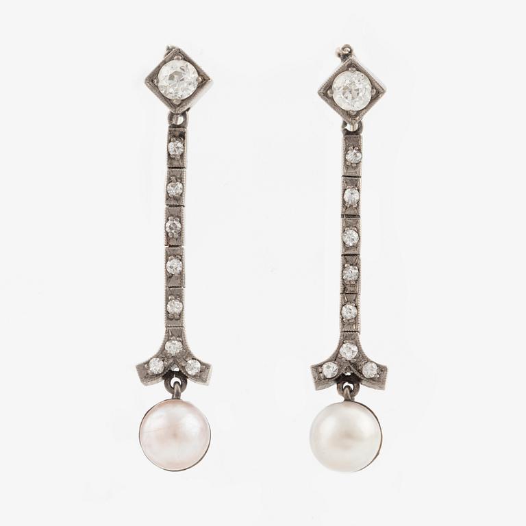 A pair of 18K gold and cultured pearl earrings.