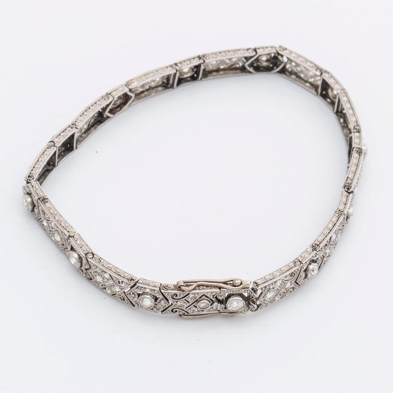 DIAMOND BRACELET, probably platinum, old and rose-cut diamonds approx 2 ct in total, 1 large stone not diamond.