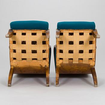 Four 1930s armchairs.