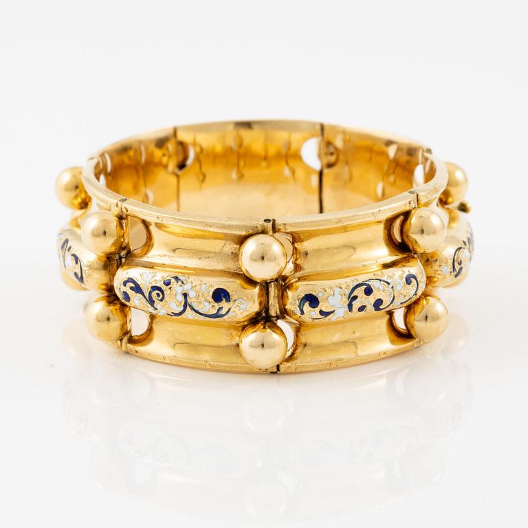 A bracelet 18K gold with enamel details.