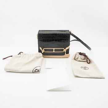 Hermès, bag "Green Shiny Alligator Mini Roulis 18 Permabrass Hardware" 2021.