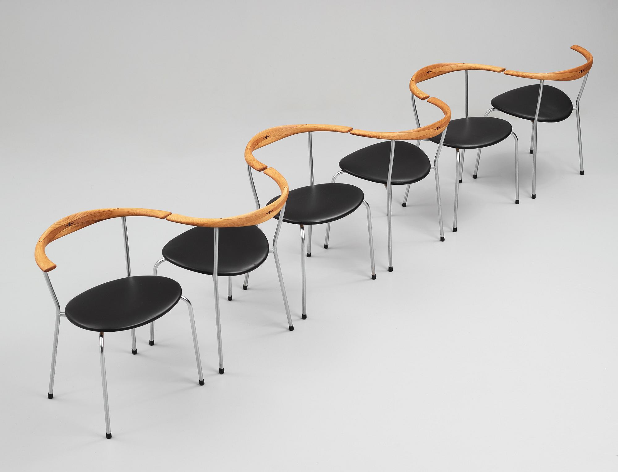 Hans J. Wegner, a set of six "JH-701" oak and black leather chairs by Johannes Hansen, Denmark.