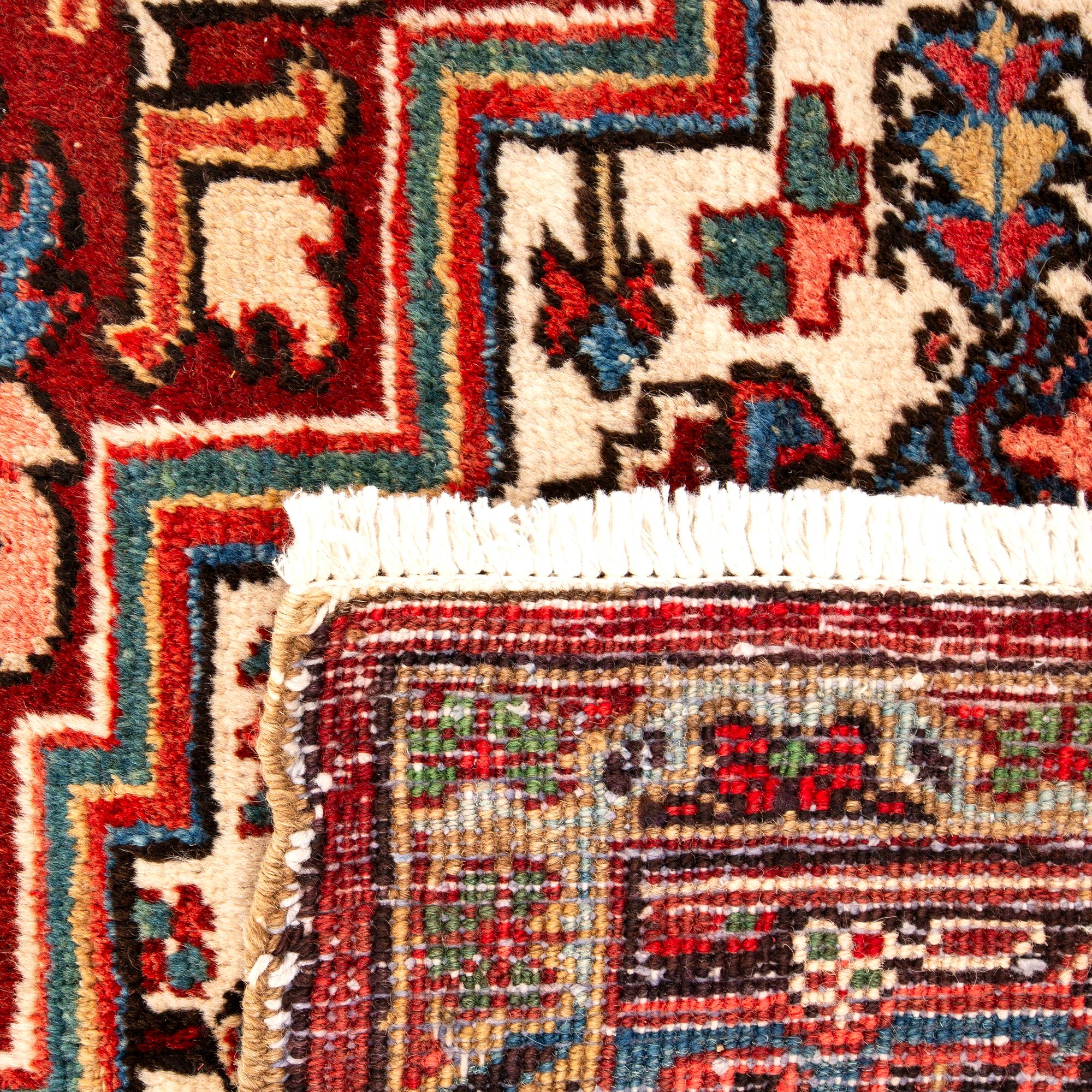 A semi-antique Heriz carpet, North west Persia, c. 366 x 282 cm.
