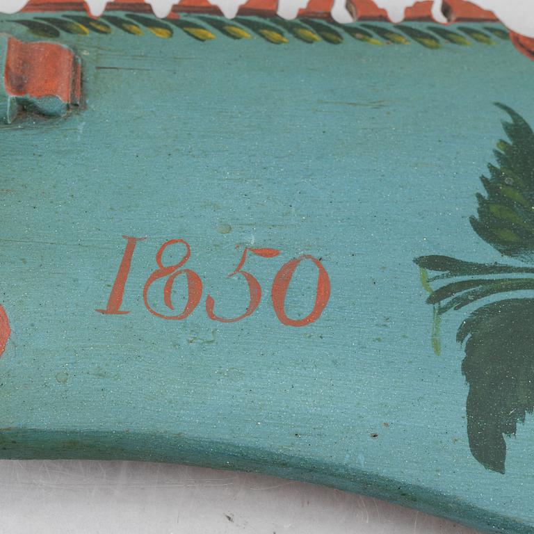 A carved and polychrome painted folk art wedding gift by P. Schenler, Hälsingland, Sweden, dated 1843.