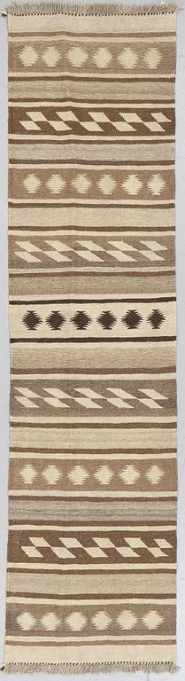 A runner, kilim, ca 240 x 62 cm.