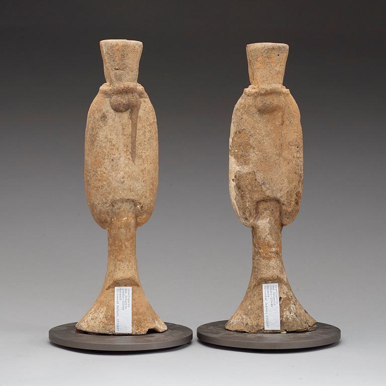 A pair of potted tomb figures of a guardiens, Han dynasty (206 B.C. - 220 A.D.).