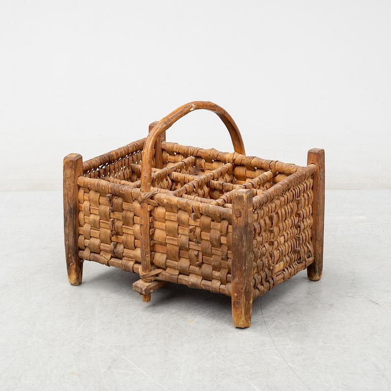 A 19th century wine bottle basket.