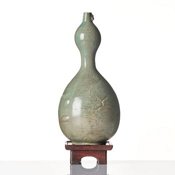 A Korean Celadon glazed double gourd bottle, Koryo dynasty, 12/13th century.