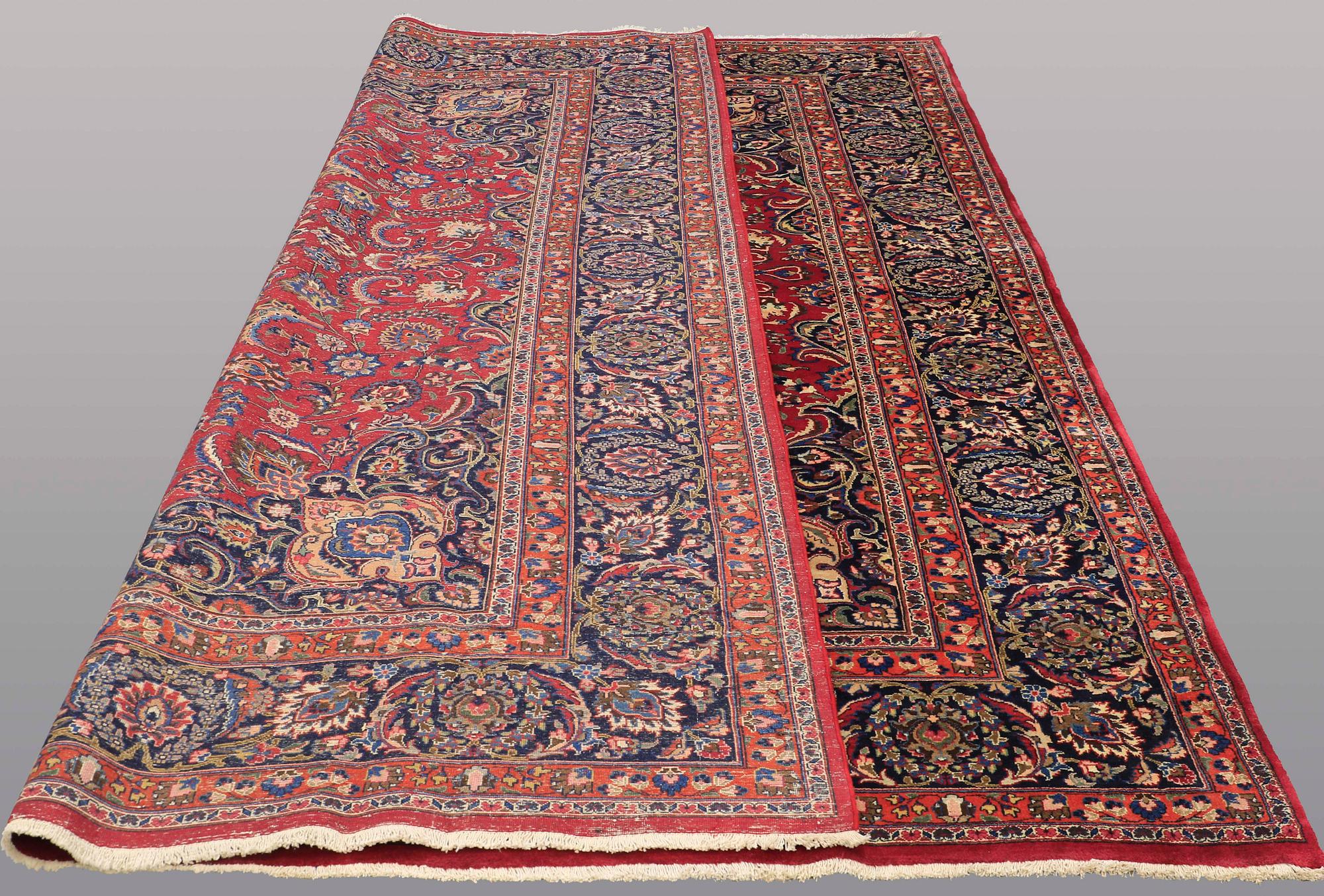A CARPET, Mashad, signed, ca 385 x 293 cm.