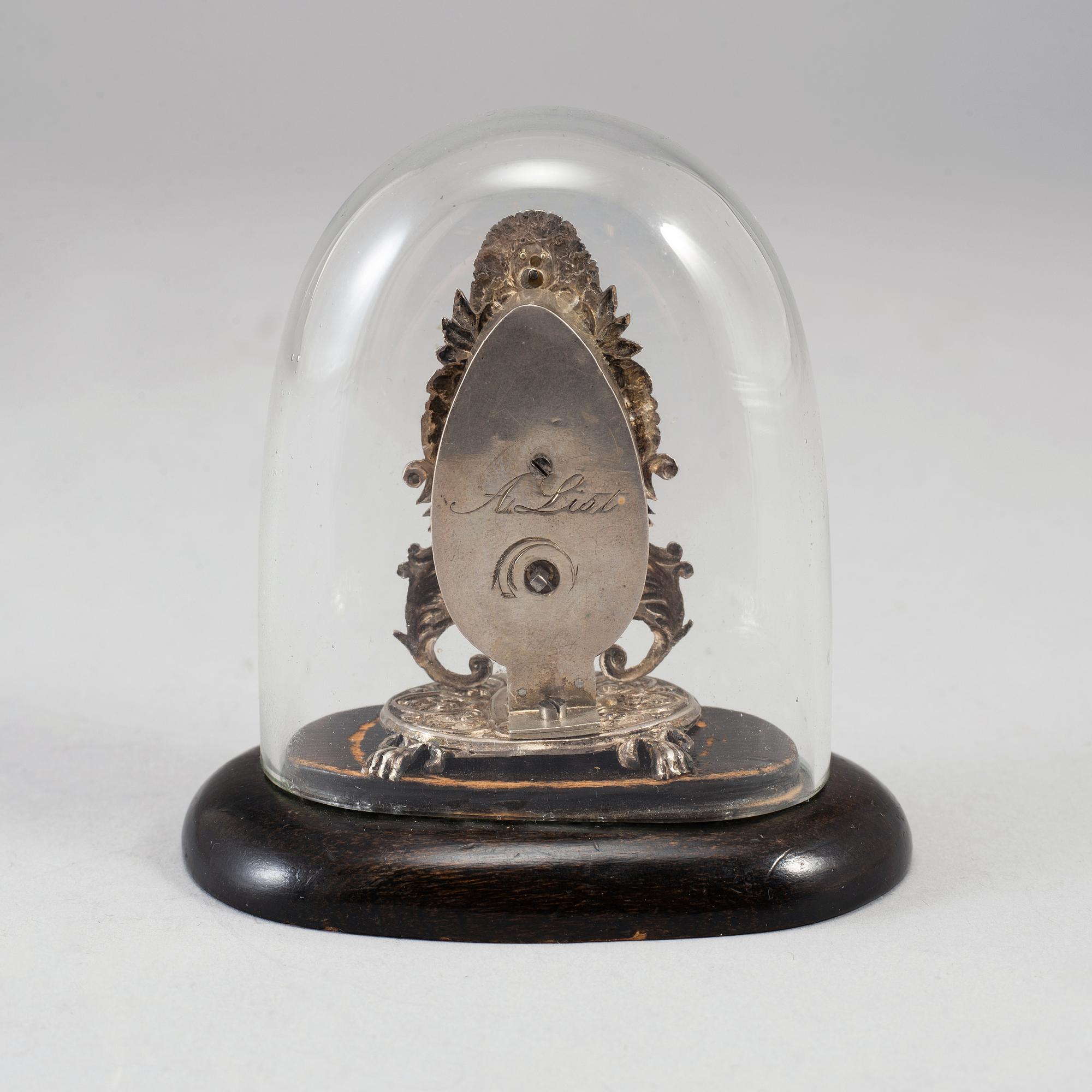 A 19th century miniature silver mantle clock.