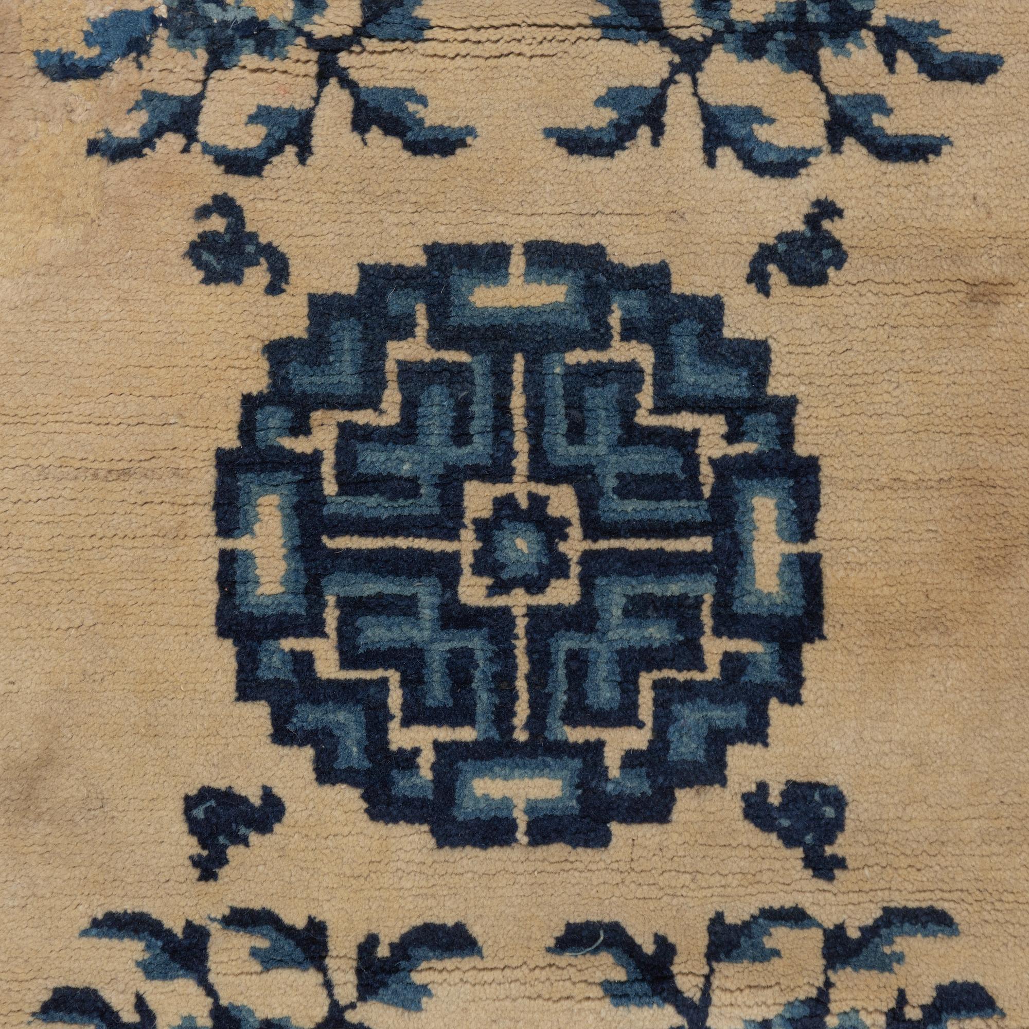 Two antique Chinese Pao-Tow rugs, c. 125 x 65 and 125 x 60 cm.