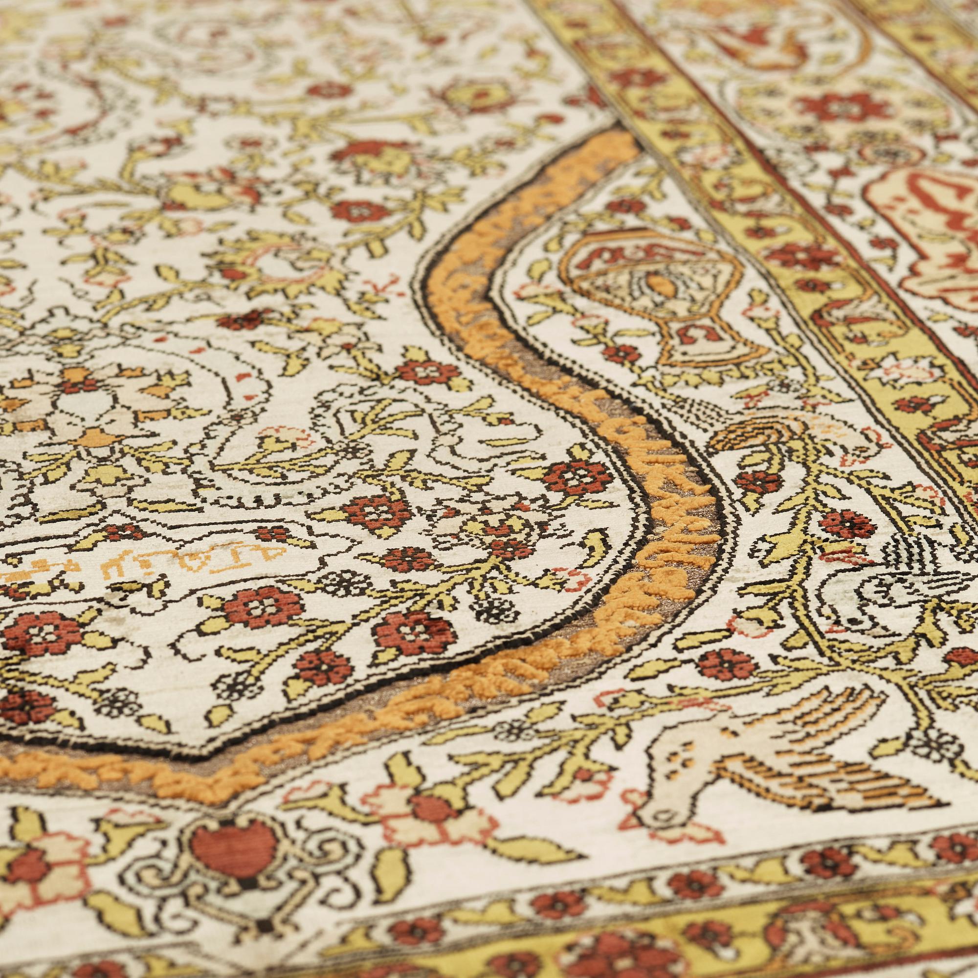 A silk Hereke possibly, around 96 x 66 cm.