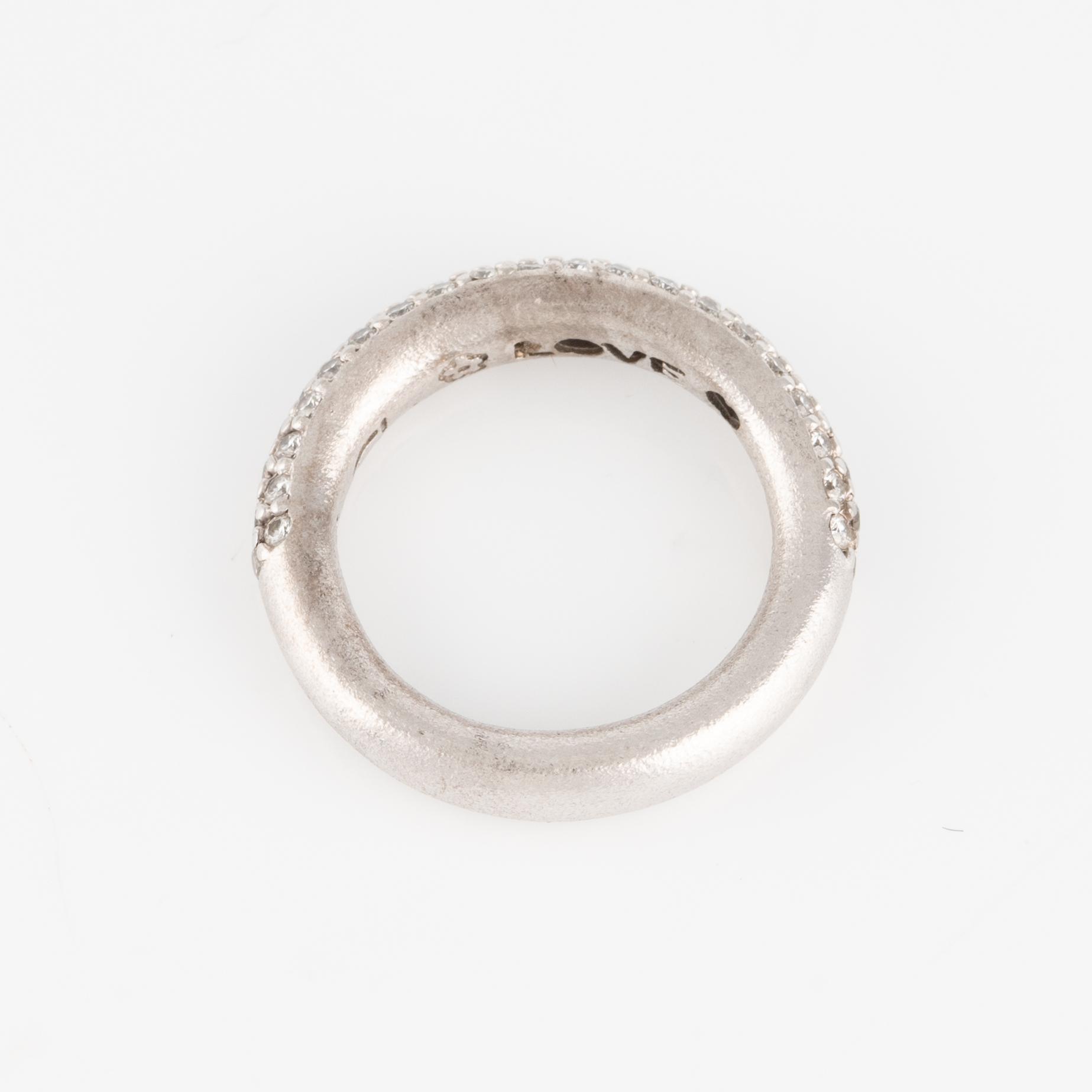 Ole Lynggaard two "Love" rings no. 4 in 18K white gold with round brilliant-cut diamonds.