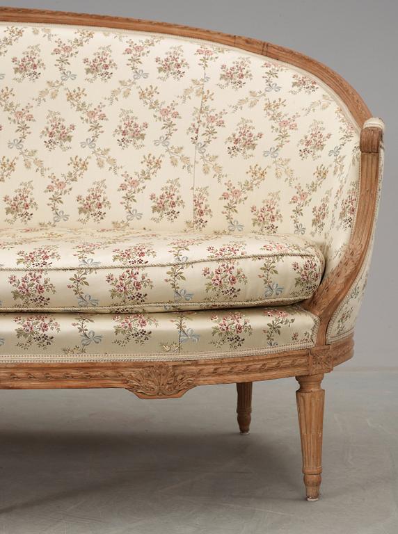 A Louis XVI 18th century sofa. Two later armchairs included.