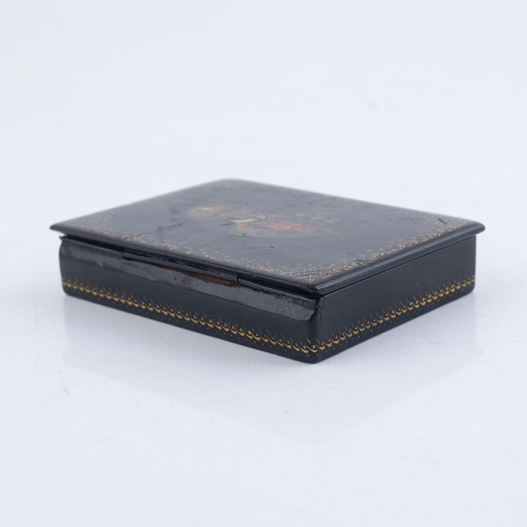 A set of three Russian lacquered papier-maché boxes, one of which from the Lukutin manufactory, 19th -20th century.