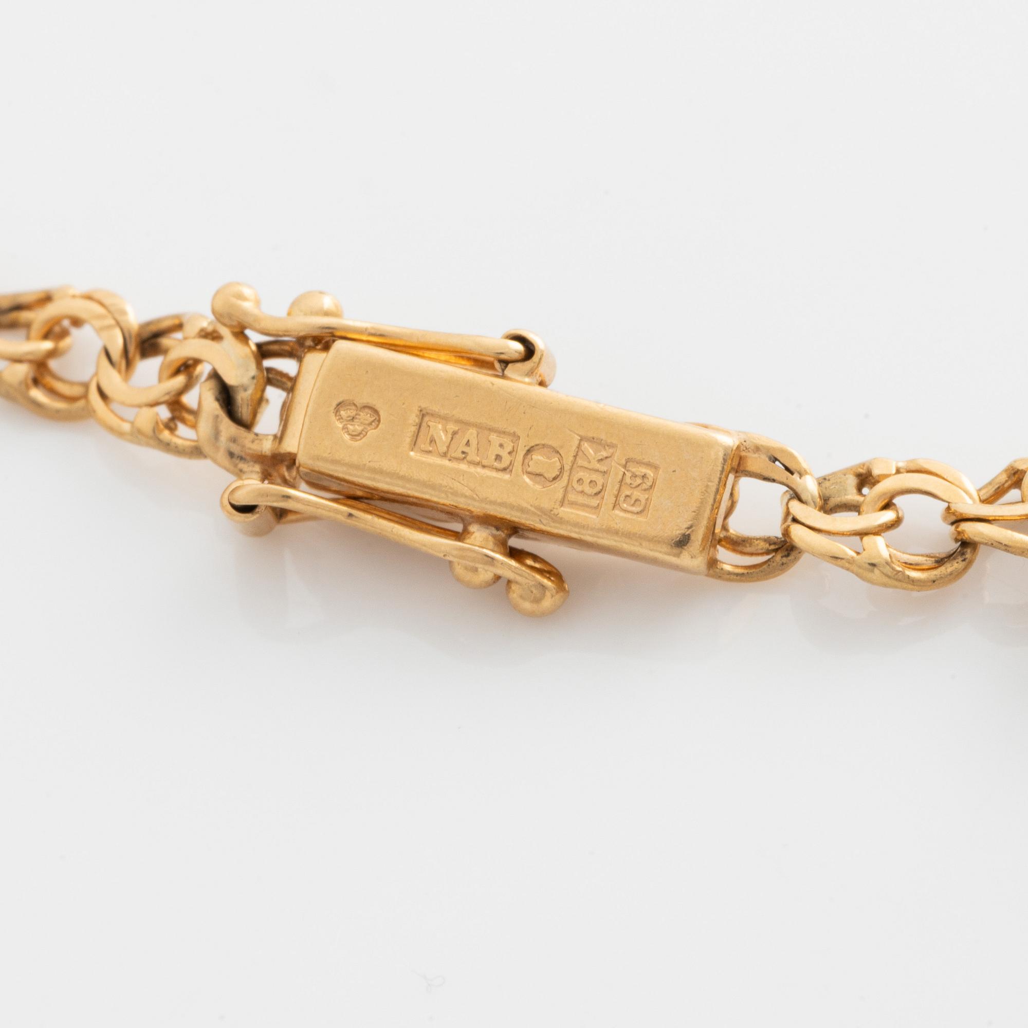 Armband med berlocker 18K guld.