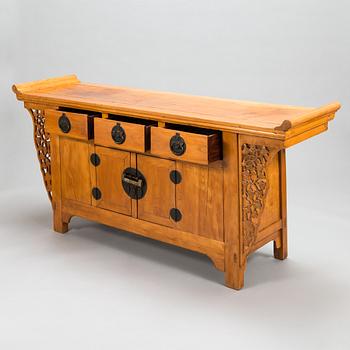 A Chinese elmwood sideboard, from around the turn of the century 1900.