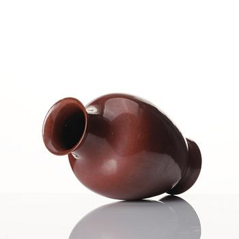 A red glazed vase, Qing dynasty, 19th century.