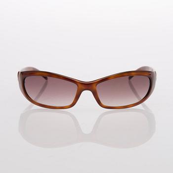 Two Pairs of Sunglasses, Prada and Chanel.
