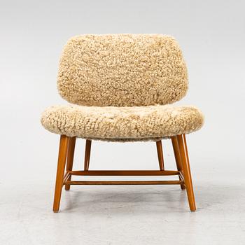 Alf Svensson, a 'TeVe' easy chair, with new sheepskin upholstery. Bra Bohag, Studio Ljungs Industrier, 1950's.