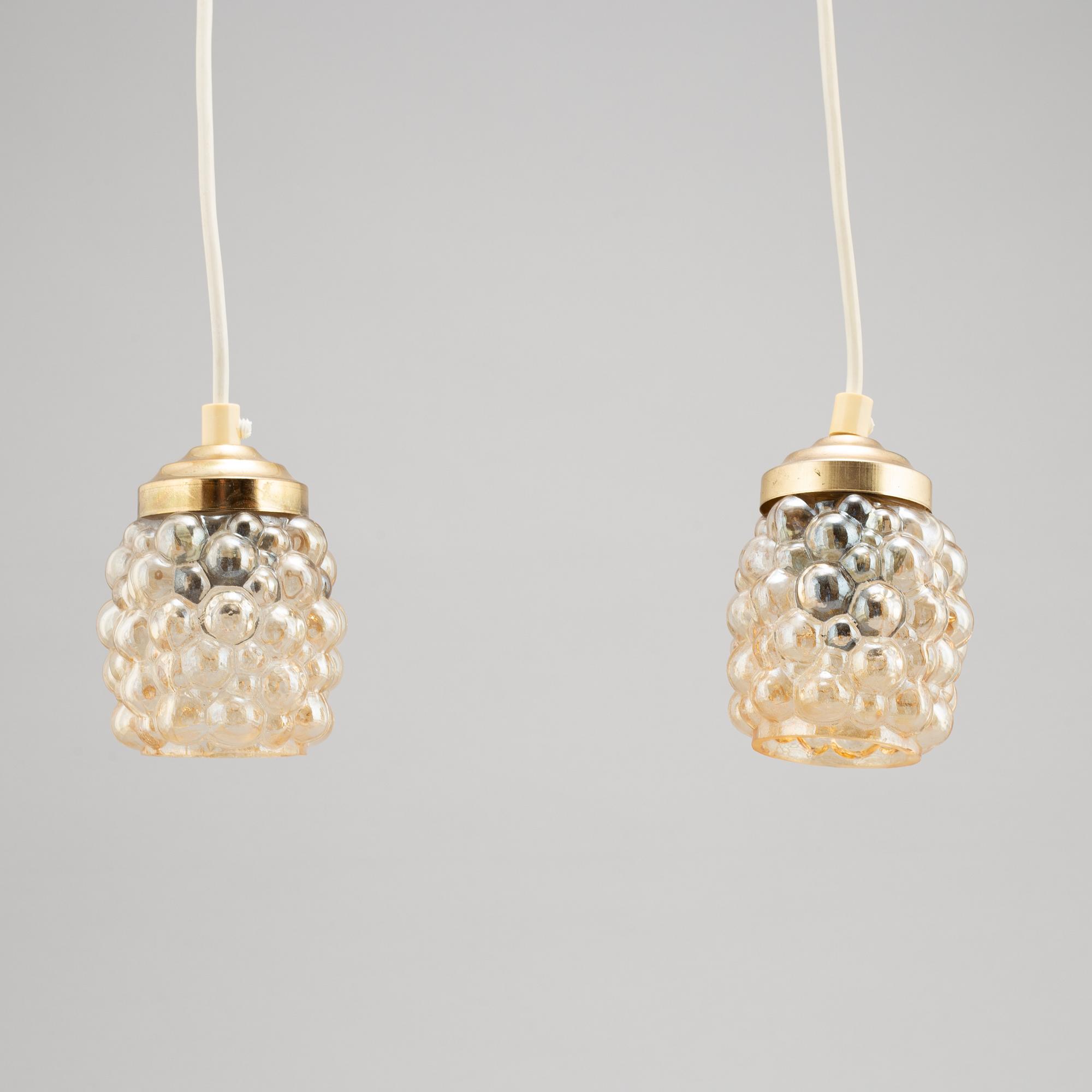 Helena Tynell, a glass wall light and a pair of ceiling lights, Glasshütte Limburg, Germany.