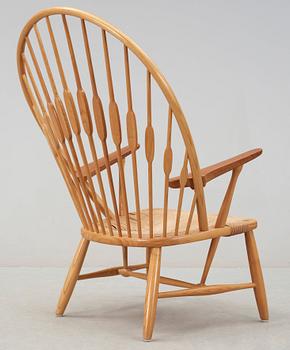 A Hans J Wegner ash and teak 'Peacock chair', Johannes Hansen, Denmark.