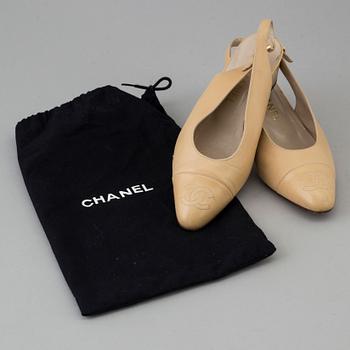 Beige leather slingbacks by Chanel.