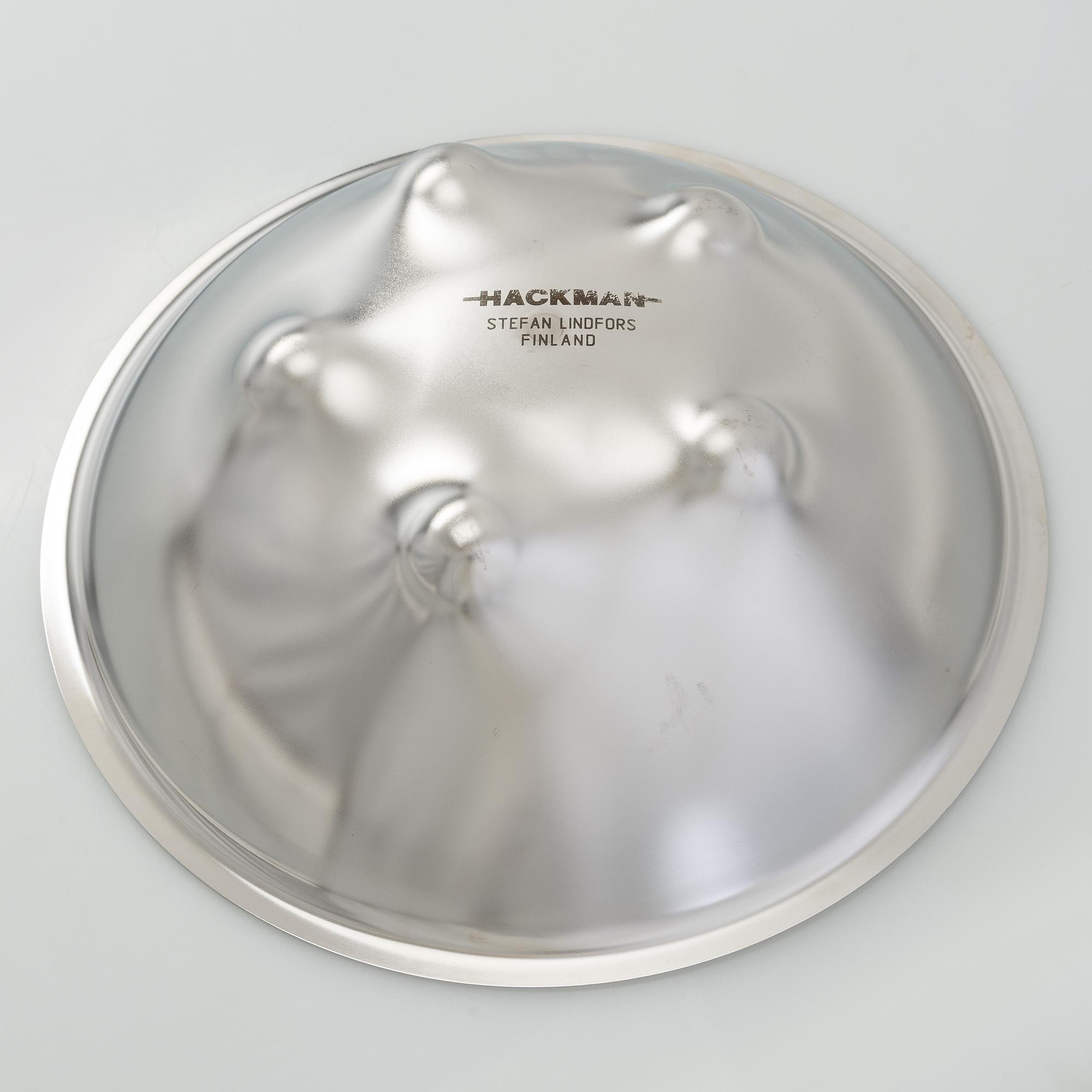 Stefan Lindfors, a stainless steel salad bowl with servers, Hackman, late 20th century.