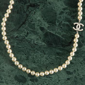 Necklace by Chanel.