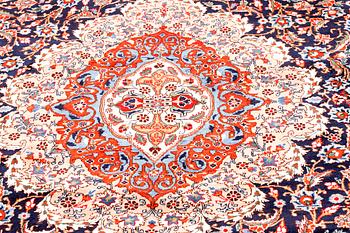 A Kashmar rug, 390 x 297 cm.