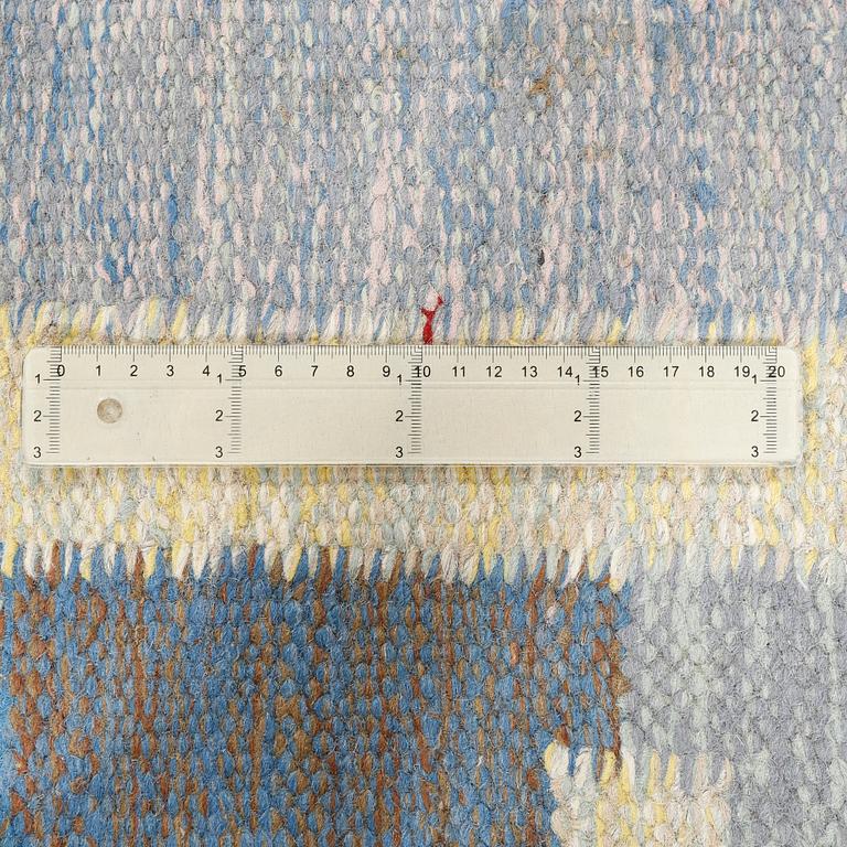 A flat weave carpet designed by Ida Rydelius from the second half of the 20th century.