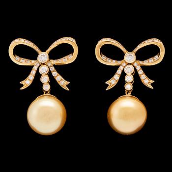 A pair of 18K gold earrings set with round brilliant-cut diamonds and cultured pearls.