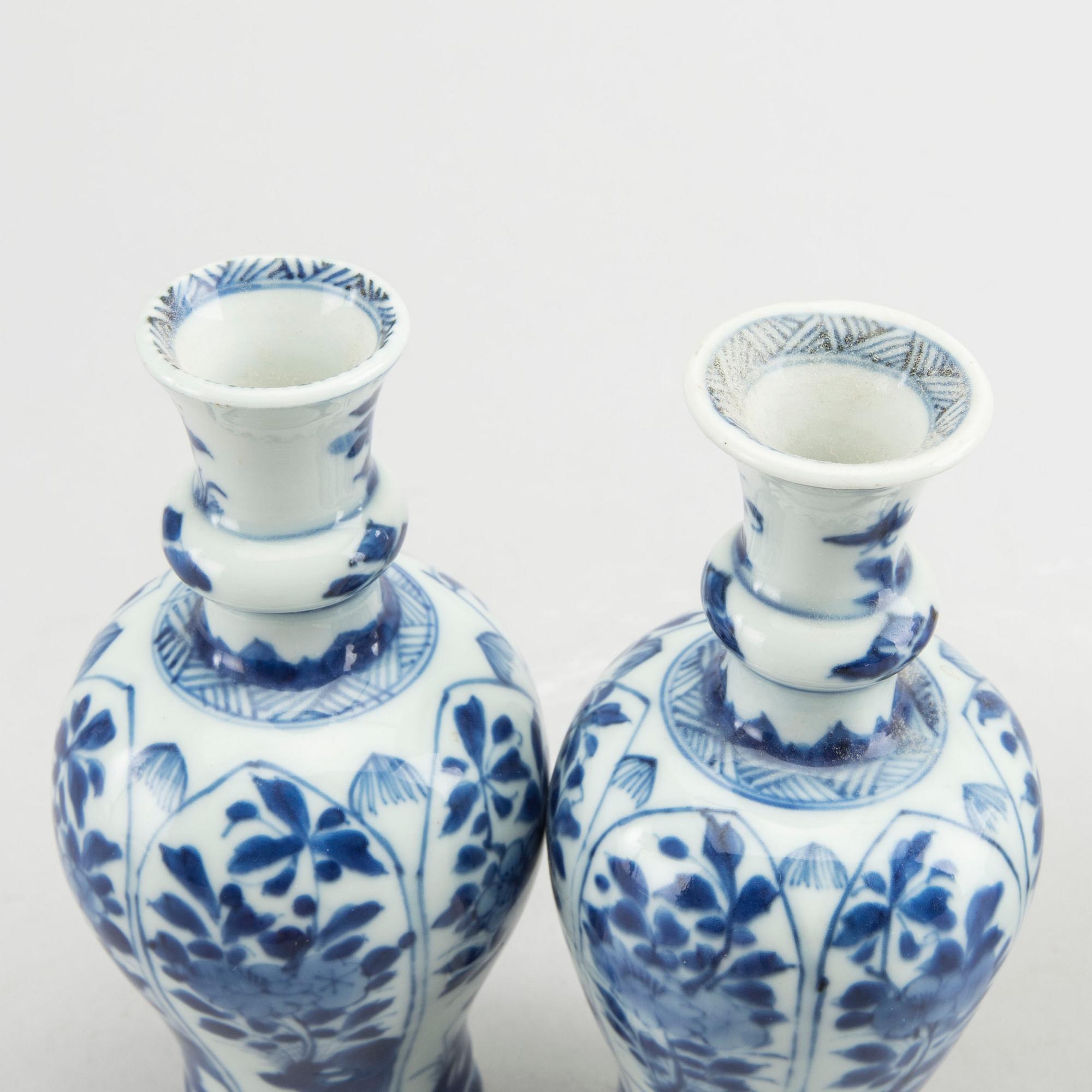 A set of two pairs of Kangxi and Kangxi style blue and white porcelain vases.