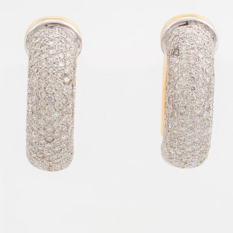 Gold and brilliant-cut diamond hoop earrings.