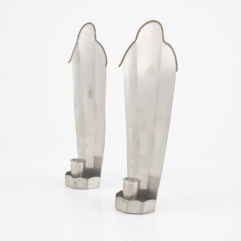 Nils Fougstedt, a pair of pewter and brass wall sconces, model "A 146", Svenskt Tenn, Stockholm 1927.