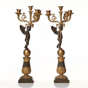 A pair of French Empire early 19th century four-light candelabra.