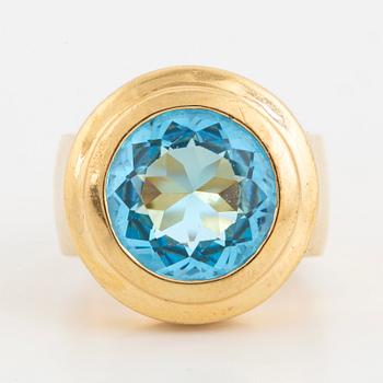 A faceted topaz ring.