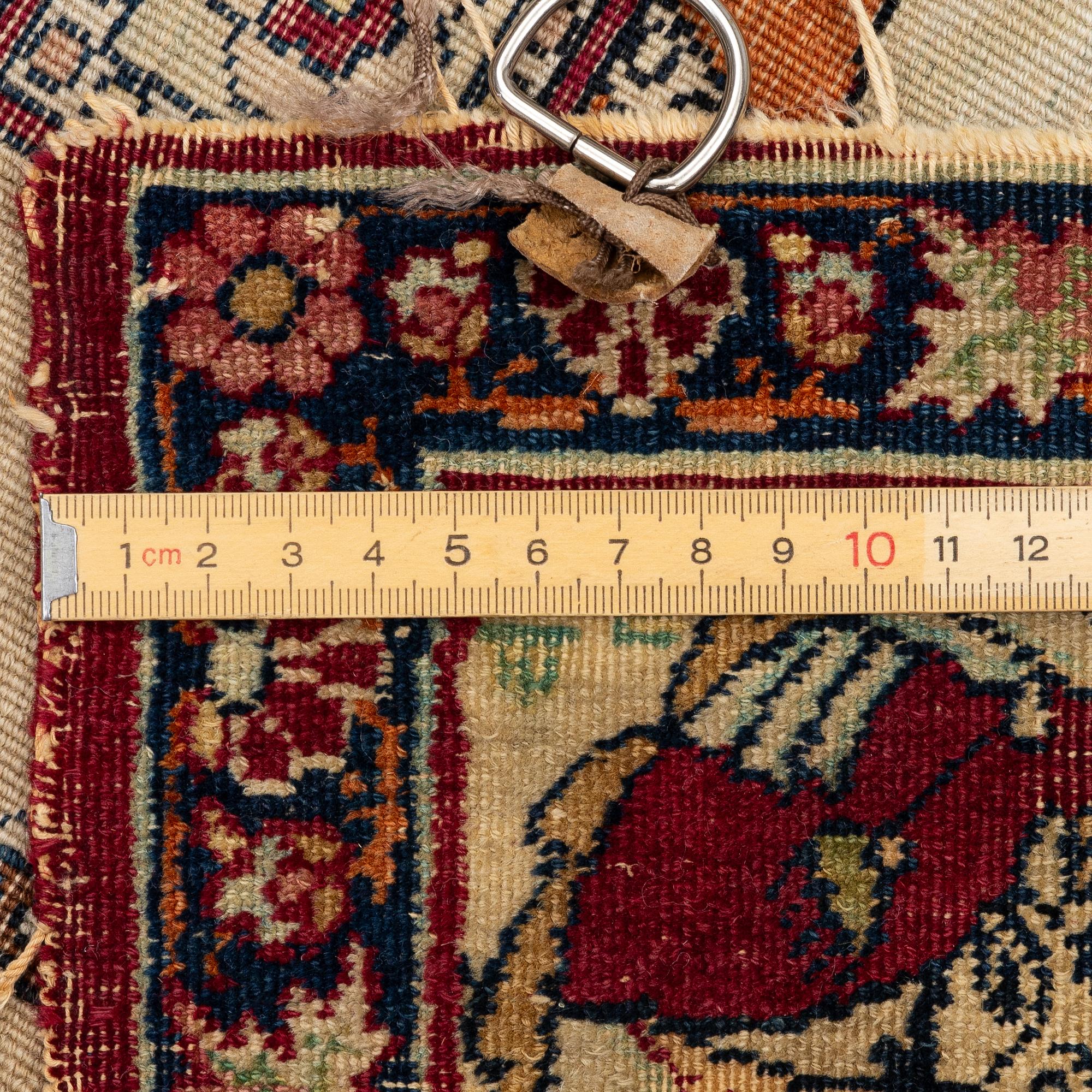 An antique Kerman Laver rug, South Persia, signed c.206 x 133 cm.