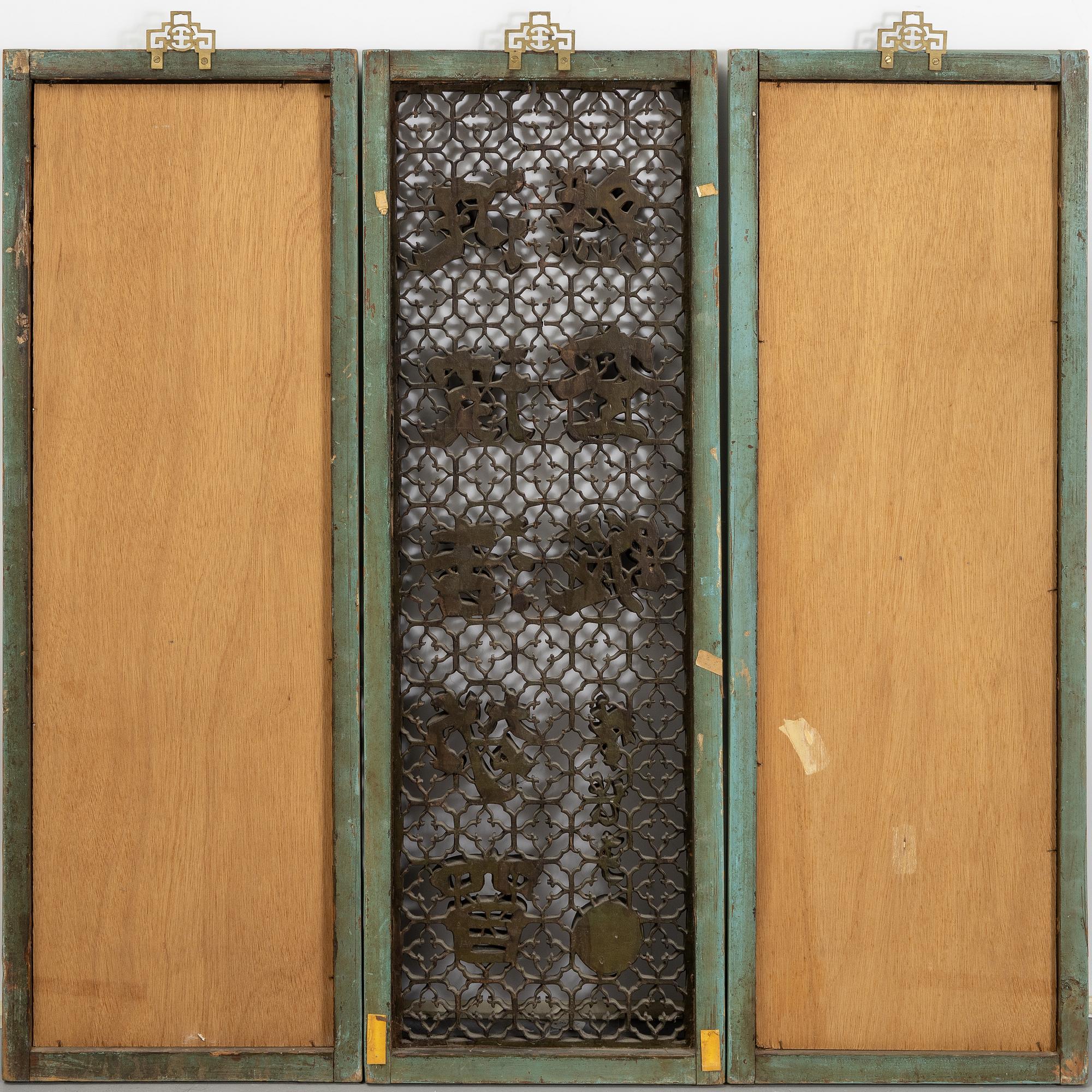Three Chinese wooden wall panels, 20th century.