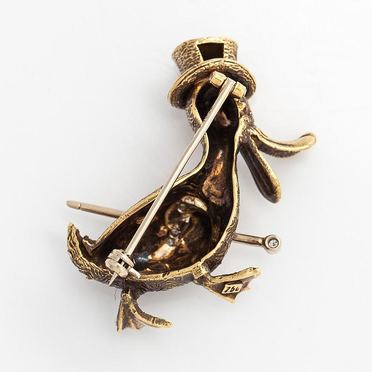 An 18K gold and diamond brooch in form of a duck.