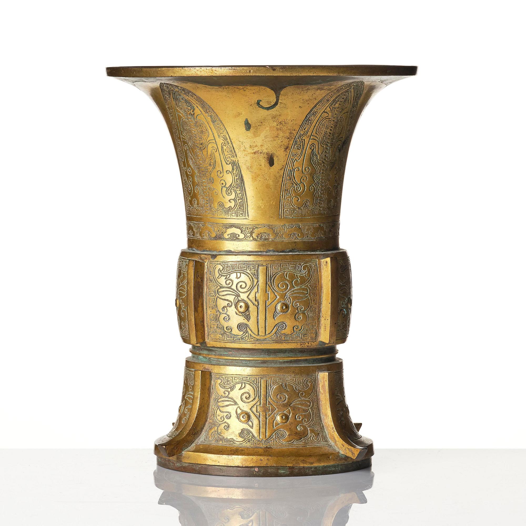 A parcel gilt/gold splashed bronze vase, Gu, 17/18th century.