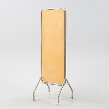 A mid 20th Century floor mirror on wheels.