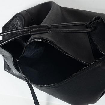 Gucci, A black leather hobo bag.